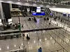The Arrivals Hall at Chek Lap Kok Airport awaits passengers earlier this month, all of whom were required to go to quarantine hotels for three nights. On Monday, Hong Kong lifted its mandatory quarantines after more than two years. [ANTHONY SPAETH]