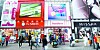 Passengers mainly consisting of foreign tourists walk by the beauty shops in Myeongdong, central Seoul.[NEWS1]