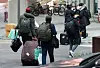 Students at the University of Seoul in Dongdaemun District, central Seoul, move out of their dormitory Tuesday to transfer to a hotel after the Seoul Metropolitan Government announced that some buildings on the school campus would be converted into so-called life treatment centers for Covid-19 patients with mild or no symptoms. [NEWS1]