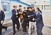 In this photo released by Seoul's Unification Ministry on Tuesday, one of two North Korean fishermen repatriated by South Korea in November 2019 is seen being half-carried by South Korean officials toward the Military Demarcation Line in the truce village of Panmunjom on the inter-Korean border. [UNIFICATION MINISTRY]