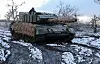 A Ukrainian serviceman of the 5th Separate Heavy Mechanised Brigade of the Ukrainian Armed Forces drives in a Leopard 1A5 tank, amid Russia's attack on Ukraine, near a front line in Donetsk region, Ukraine, on Feb. 4. [REUTERS/YONHAP]