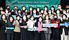 Hana Financial Group Chairman Ham Young-joo, center, poses with workers who completed the company’s program designed to nurture women leaders. [HANA FINANCIAL GROUP]