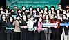 Hana Financial Group Chairman Ham Young-joo, center, poses with workers who completed the company’s program designed to nurture women leaders. [HANA FINANCIAL GROUP]