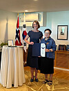 Ambassador of Norway to Korea Anne Kari H. Ovind, left, presents Kim Miy-He, professor emeritus at the Theatre and Film Department of Hanyang University, the Royal Norwegian Order of Merit for her work translating Henrik Ibsen’s plays at Norway's diplomatic residence in Seoul on Thursday. Kim has been appointed Commander of the Royal Norwegian Order of Merit by His Majesty King Harald V of Norway for her work translating all of Henrik Ibsen’s plays and for her contribution to making Henrik Ibsen and his plays known in Korea, according to the Norwegian Embassy in Seoul. [EMBASSY OF NORWAY IN KOREA]