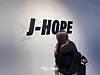 An international fan writing a message at J-Hope’s “And What?” Exhibition at AK Plaza in Hongdae, western Seoul [DANIELA GONZALEZ PEREZ]
