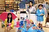 Models promote umbrellas, rain shoes and dehumidifiers, which are selling well during the monsoon season. [EMART]