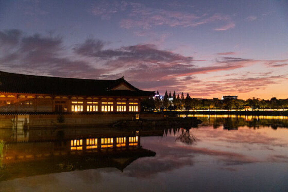 Yeonhwajeong Library, a hanok library in Jeonju, North Jeolla, sitting beside Deokjin Pond with traditional Korean architecture reflected in the water