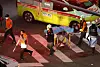 First responders move bodies from Itaewon, Seoul, Sunday. [YONHAP]