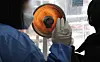 An electric heater warms the medical staff at a Covid-19 testing center in Mapo District, western Seoul, on Monday. [YONHAP]