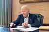 U.S. President Joe Biden sits at his desk in the White House residence in this handout photo obtained from President Biden's Twitter account on July 21. [REUTERS, YONHAP]