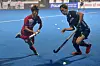 Hwang Tae-il, left, and Japan's Kawabe Kosei fight for the ball during a men's field hockey match between Japan and Korea at the Asian Championship Trophy tournament in Dhaka, Bangladesh on Wednesday. Korea are tied for second after holding Japan to a 3-3 draw. After two more preliminary matches, the top four teams will advance to the semifinals. [AFP/YONHAP]