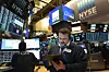 A stock trader works at the New York Stock Exchange on Friday, March 2020. [AP]
