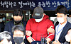 The suspect allegedly behind an online pornography ring known by the internet alias 'God God' leaves a police precinct in Andong, North Gyeongsang, to attend a court hearing for his arrest on Tuesday. [YONHAP]