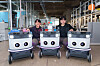 Neubility Vice President Kang Kee-hyuk, left, and Neubility CEO Lee Sang-min pose with three Neubie robots at the Neubility office in Seongdong District, eastern Seoul [CHO YONG-JUN]