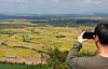 The Cheorwon Plain in Gangwon is seen glowing in golden hues as rice fills the fields as viewed from the summit of Mount Soi on Monday, a week before the Chuseok harvest holiday. [YONHAP]