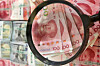 Chinese yuan is inspected at Hana Bank’s Counterfeit Notes Response Center in Jung District, central Seoul, on Aug. 22. [NEWS1]
