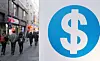People walk near a currency exchange counter in central Seoul on Jan. 10. [NEWS1]