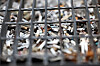 Cigarette butts stacked in a road gutter drain near Gangnam Station in southern Seoul on June 23 [YONHAP]