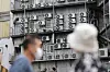 Air conditioners on the side of a building in Seoul oon Monday. With rising heat, energy consumption is expected to rise with more people turning on the cooling system. Yet the government has decide to freeze the energy bill in the third quarter worrying rising inflation impact on household amid Covid-19. [YONHAP]