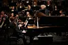 Korean pianist Cho Seong-jin performs together with the London Symphony Orchestra under the baton of Sir Simon Rattle on Oct. 13 to officially open the new LG Arts Center Seoul in Magok, western Seoul. [KIM YOON-HEE, LG ARTS CENTER]