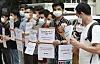 A group of Afghans living in Korea implore the government to evacuate their families from Afghanistan, fearing retaliation from the Taliban, in a press conference in front of the Foreign Ministry in central Seoul Monday. Seoul is considering support for Afghans who helped on Korean government cooperation projects in Afghanistan. [NEWS1]
