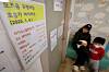 A notice board shows trends in respiratory disease cases at a pediatric clinic in Yongin, Gyeonggi, on Jan. 10, amid a sharp rise in influenza and other respiratory illnesses. [YONHAP]