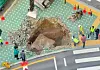 A sinkhole appears in front of the IFC Mall in Yeouido, western Seoul on Wednesday. [YONHAP]