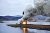 The artist's daljip is set on fire on Saturday in Cheongdo, North Gyeongsang. [SANGTAE KIM, COURTESY OF THE ARTIST AND JOHYUN GALLERY]