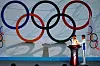 Participants transfer the Olympic flame from a cauldron at the ceremony to welcome the flame for the Beijing 2022 Winter Olympics in Beijing on Oct. 20. [REUTERS/YONHAP]