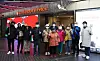 A group of tourists from Singapore pose in front of the Lotte Duty Free store in central Seoul on Monday. They were the first group of foreign tourists there in almost two years after overseas travel was limited due to the pandemic. Korea and Singapore signed a travel bubble agreement which became effective on Nov. 15. [LOTTE DUTY FREE]