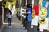 Trees are wrapped with colorful warmers on a street in Gwangmyeong, Gyeonggi, on Wednesday as it gets chilly. [NEWS1]