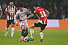 Girona midfielder Kim Min-su, left, vies for the ball during the Champions League match against PSV Eindhoven at Philips stadium in the Netherlands on Nov. 5. [AP/YONHAP]