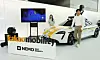 Models introduce the self-driving robots and a Porsche Taycan equipped with the sensors needed for building Kakao Mobility's digital twin, during the “Next Mobility: NEMO 2022” held in Coex, southern Seoul, Thursday. [YONHAP]