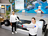 Models pose with SK On's Super Fast EV battery at the company's booth for the CES 2023 trade show in Las Vegas. [SK ON]