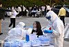 A high school student in Ulsan gets tested for Covid-19 on Thursday. Officials ordered all 507 students and 82 faculty and staff at the high school to get a Covid-19 test after a high school senior tested positive the same day. [YONHAP]