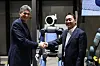 Zachary Jackowski, left, head of humanoid development at Boston Dynamics, and Oh Se-uk, head of the Robotics Business Innovation Group at Hyundai Mobis, take a photo with the Atlas humanoid robot after an interview with the Korean press on the sidelines of CES 2026 in Las Vegas on Jan. 7. [HYUNDAI MOTOR]