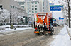 A vehicle sprays salt on the roads in Gwangju on Dec. 18 during a heavy snow advisory. [YONHAP]