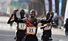 Gold medalist Jemal Yimer Mekonnen of Ethiopia, center, celebrates as he crosses the finish line during the 2024 Seoul International Marathon in southern Seoul. He came in first in two hours, six minutes and nine seconds. [XINHUA/YONHAP]