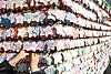 Visitors to Jogye Temple in Jongno District, central Seoul, on Tuesday write their wishes on star-shaped paper and hang them on a wall set up in the yard. [KANG JUNG-HYUN]