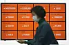 Prices of Bitcoin and altcoins, including Chainlink and Tron, are displayed on a digital screen on April 29 at Bithumb’s office in Gangnam, southern Seoul. [NEWS1]