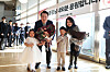 President Yoon Suk-yeol and first lady Kim Keon-hee pose for a commemorative photo with children at an event to bid farewell to their neighbors at their private apartment in Seocho-dong, southern Seoul, Saturday, after moving into the new presidential residence in Hannam-dong in Yongsan District last month. [PRESIDENTIAL OFFICE]