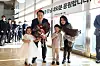 President Yoon Suk-yeol and first lady Kim Keon-hee pose for a commemorative photo with children at an event to bid farewell to their neighbors at their private apartment in Seocho-dong, southern Seoul, Saturday, after moving into the new presidential residence in Hannam-dong in Yongsan District last month. [PRESIDENTIAL OFFICE]