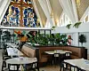 The Good Shepherd Lutheran Church in Des Plaines, Ill., was converted into a restaurant called Foxtail on the Lake, on May 22, 2024 With vaulted ceilings and stained glass windows, the architectural features of churches have become huge draws for business owners. (Lyndon French/The New York Times)