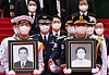 President Yoon Suk-yeol, center, takes part in a procession to transfer the remains of 17 independence fighters of the Korean Liberation Army to the Daejeon National Cemetery in a ceremony at the Seoul National Cemetery in Dongjak District, southern Seoul, Sunday. [YONHAP]