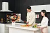 Models stand next to Samsung Electronics' Smart Monitor M8 which features a slimmer design and upgraded app services. The product will go on sale in Korea from Monday. [SAMSUNG ELECTRONICS]