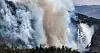 A helicopter from the Korea Forest Service disperses fire retardants across mountain ridges in Uiseong County in North Gyeongsang on March 23. [YONHAP]