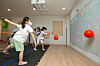 Children participate in an indoor field day at the Yongsan District Office in Seoul on Tuesday. KT said it is working with four institutions within Yongsan on a metaverse field trip using its KT Real Cube system. Without having to wear special equipment, children can take part in the online field trip, which uses motion sensors so they can play games with other kindergarten children via virtual reality and augmented reality systems. [KT]