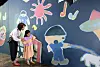 Visitors look at a mural in the 'Twinkle Twinkle Little Hands' exhibition, as part of Korea Craft Week 2023. [NEWS1]
