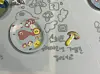 A ceramic plate made by one of 60 children for the 'Twinkle Twinkle Little Hands' exhibition, as part of Korea Craft Week 2023. The description reads, 'I like Super Mario games.' [SHIN MIN-HEE]