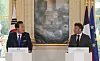 President Yoon Suk Yeol, left, and French President Emmanuel Macron hold a joint press briefing at Elysee Palace in Paris on Tuesday. [JOINT PRESS CORPS]